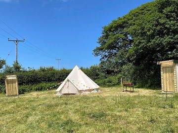 Bell tent pitch backed by trees (added by manager 29 jun 2023)