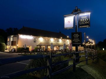 The red lion lit up at night