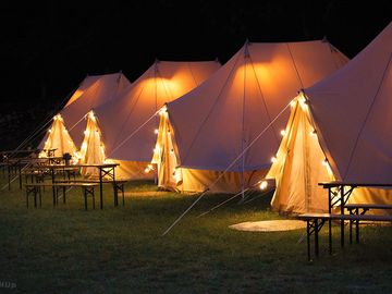 Bell tents lit up at night (added by manager 06 feb 2024)