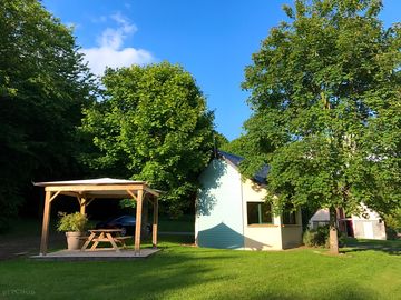 Welcome desk, and kiosk with picnic table available.