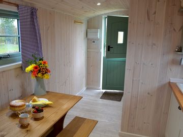 Shepherds hut stable door, dining & seating area