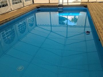 Covered and heated swimming pool