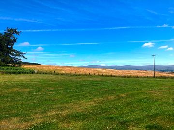 Open fields leading to the fells