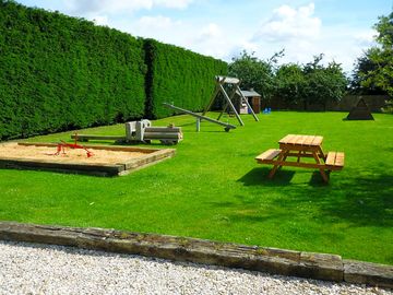 Playground and picnic bench (added by manager 21 may 2015)