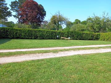 Spacious pitches marked out with hedges
