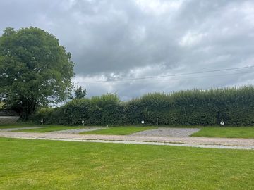 Electric hardstanding and grass motorhome pitch