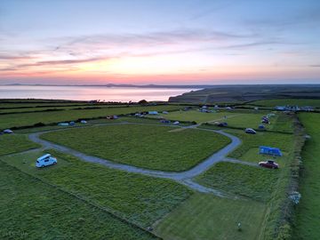 Sunset over the sea at shortlands farm campsite.