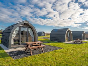 Camping pod with bunks, double sofa bed. electrical outlets and underfloor heating