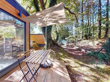 Shaded deck looking out into the woods