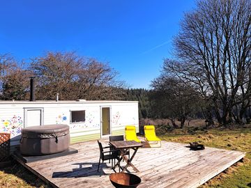 Nestling amongst the trees with a spacious decking and beautiful views
