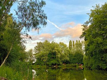 View from the far side of the lake looking back at the communal kitchen. (added by jeremy_f891534 05 aug 2023)