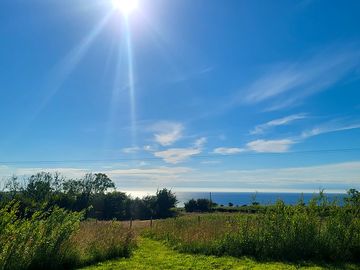 Path to the grass pitch and sea view