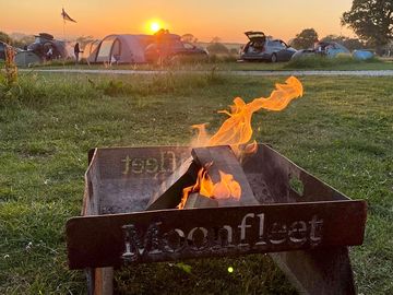 The setting sun from our pitch with our moonfleet firepit!