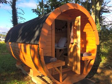 Wooden pod with outdoor seating area