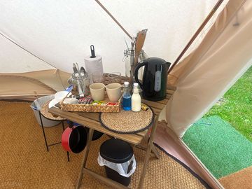 Mini-kitchen area with fridge inside the tent