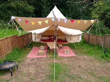 Bell tent with awning, fencing, fairy lights, firepit and low tables (added by manager 31 mar 2022)