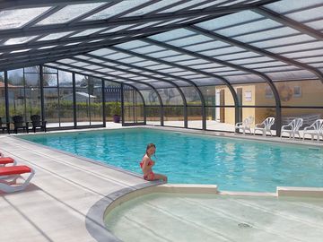 Covered swimming pool with paddling pool