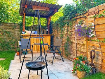 Paved terrace with outdoor kitchen and barbecue