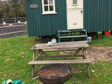 Outside seating area with barbecue and firepit