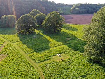 Aerial view of site with mown pitches