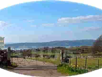The campsite entrance with views over Morecambe Bay (added by manager 08 Mar 2012)