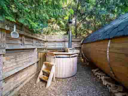 The wood-fired hut tub is very popular in the Owl pods.