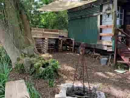 The Copse's firepit area and kitchen under awning