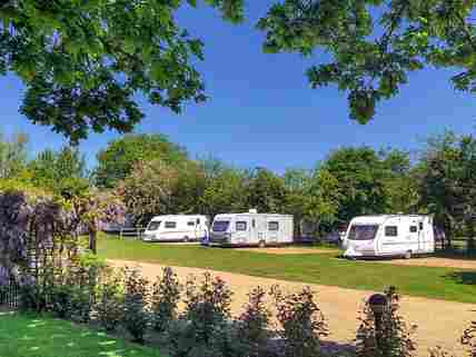 Sun shining over the touring pitches