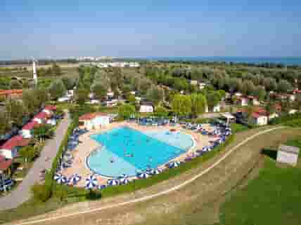 Aerial view of the site and its pool