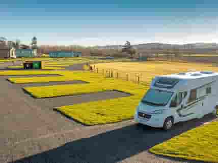 Gravel pitches for Tourers, Motorhomes and Campervans. Electric hook up available.