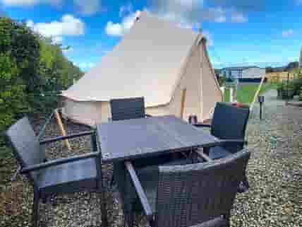 Bell tent with outdoor seating area