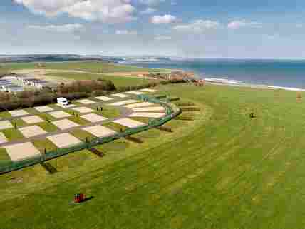 Aerial view of the main tent field and super pitches for touring caravans