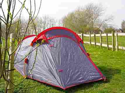 A tent set up in the orchard