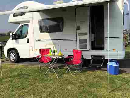 Motorhome serviced pitch with hardstanding and grass
