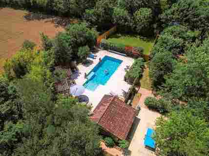 Aerial view of the site and the pool
