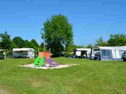 Standard camping pitch with playground equipment