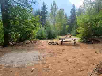 Tent site with picnic table and firepit