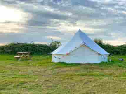 Bell Tent exterior with picnic table