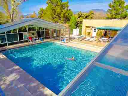 Pool enclosure in the open position