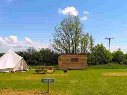 The pitch has a  private compost toilet and a kitchen cabin, as well as fire pit and picnic table as