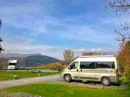 Campervan pitch with hardstanding, grass for awning and electric hook up