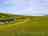 Compton Farm Caravan and Camping: Visitor image of the morning view with cliffs in the background