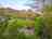 Shilla Mill: View across a pitch into the site 