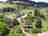 Ranch Lambergar: View of the site and the farmhouse, with a fruit orchard 