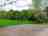 Church Stile Farm Holiday Park: Hardstanding pitch with grass area adjacent