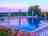 Camping Veliko Tarnovo: Swimming pool and flower garden at dusk