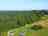 Avon Tyrrell Outdoor Activity Centre and Campsite: Drone image from above of Avon Tyrrell's lakeside camping and main house, with trees and blue skies (photo added by manager on 01/24/2025)