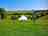 Harriet's Hideaway: Bell tent surrounded by sloping countryside (photo added by manager on 02/05/2024)