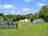 Retanna Holiday Park: Pitches and play area (photo added by manager on 08/01/2022)