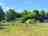 Heathfield Farm Camping: Grass pitches and site entrance